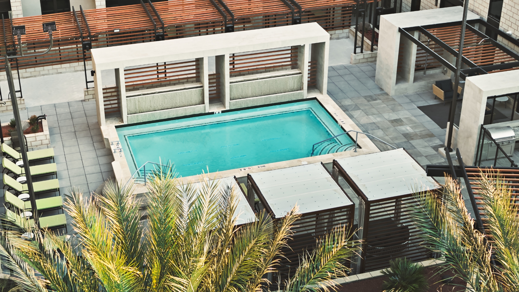 An illustration of an outdoor pool and lounge area at a Life Time Living location