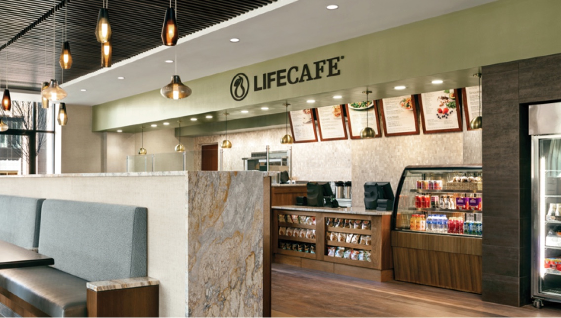 Guest seating, the menu and checkout counter at the LifeCafe.