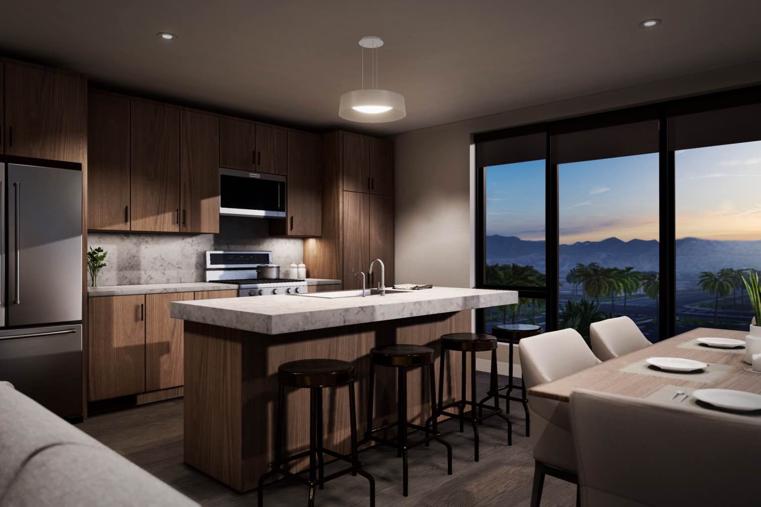 High-end kitchen in an apartment with a sunset mountain view out the window